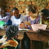 Grace Burleson teaches a group of people in Uganda during her internship.