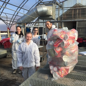 Some of the Environmental Engineering Technology Class with a bag of disposable coffee cups found during one of the waste audits