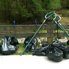 Bags of refuse collected by the volunteers. A portion of the lake is visible in the background.