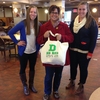 Buyer’s club creators Emily Marguerite and Jen Curry with their first customer, Liz Barringer-Smith, sporting her sweatshop-free reusable bag