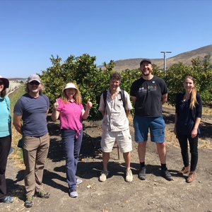 Cal Poly faculty visit the fruit orchard and organic farm in between sessions to learn about farming practices and operations on campus, and how they can incorporate this opportunity into their classes as a living lab.