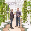 Aggie Green Fund grant recipients, Broch Saxton and Lisette Templin, observe the health of their harvest.