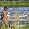 Solar panel-topped ponds under construction at the Cornell Experimental Pond Facility.