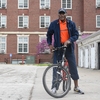 Urbana campus Chancellor Robert J. Jones tests out his borrowed bicycle before embarking on a ride around campus alongside more than 30 students, staff, faculty, and community members.