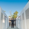 Kenny Seeton, Central Plant/energy manager at CSUDH, stands among 20 Tesla battery banks installed on campus to help reduce the university’s impact on the local power grid.