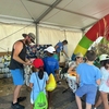 CCC's environmental sustainability office members conduct demonstrations with Nebraska elementary school students at the sustainabililty pavilion on opening day at the Nebraska State Fair.