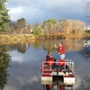 Bob Newton, director of the Center for the Environment, Ecological Design, and Sustainability, and professor of geosciences, conducting research on Paradise Pond with a student.