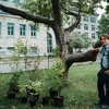 Eric Champagne, McGill's Horticultural Supervisor, showcasing his tree seedlings