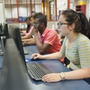 Students utilizing computer labs to access open resource material online.