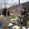 A student stopping by UConn’s Soil and Water Conservation Society’s Earth Day Spring Fling table. This year, each student that visited their table tied a ribbon to a tree with a few words about what they love about the environment.