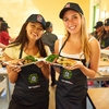Stanford students enjoying the seared salmon, sauteed spinach, and roasted heirloom potatoes dish they cooked in their R&DE Teaching Kitchen class.