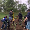 Students, faculty and staff work together on Earth Day to install a student-designed pollinator garden