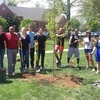 Students helping with tree planting ceremony