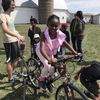 A young Iowa City girl makes a bike-powered smoothie at the Iowa Physicians for Social Responsibility Earth Day event in Iowa City