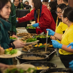 Volunteers serving a meal from Cafe Ohlone