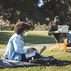 Stanford students study outside at the Stanford campus