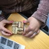 Penn State Green Teams member Amber Redman is creating a drink coaster made from wine bottle corks at an event during Penn State’s multi-week Earth Day(s) 2017 celebration.