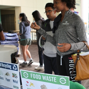 Student at event recycling station