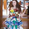 One of the models for the Trash Fashion show in a dress made from magazine advertisements.