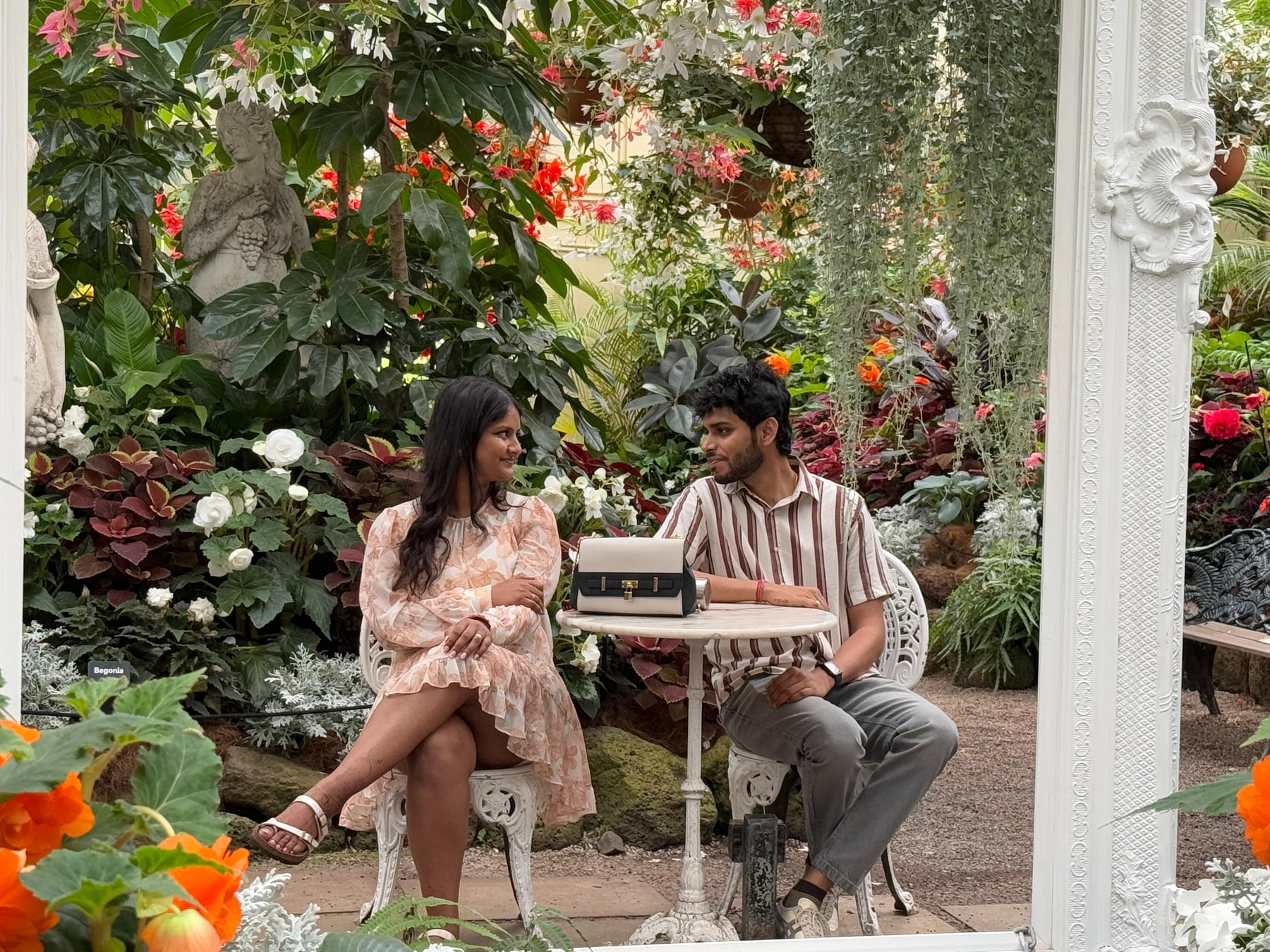 the two of us at a little table, inside all those flowers 🌸