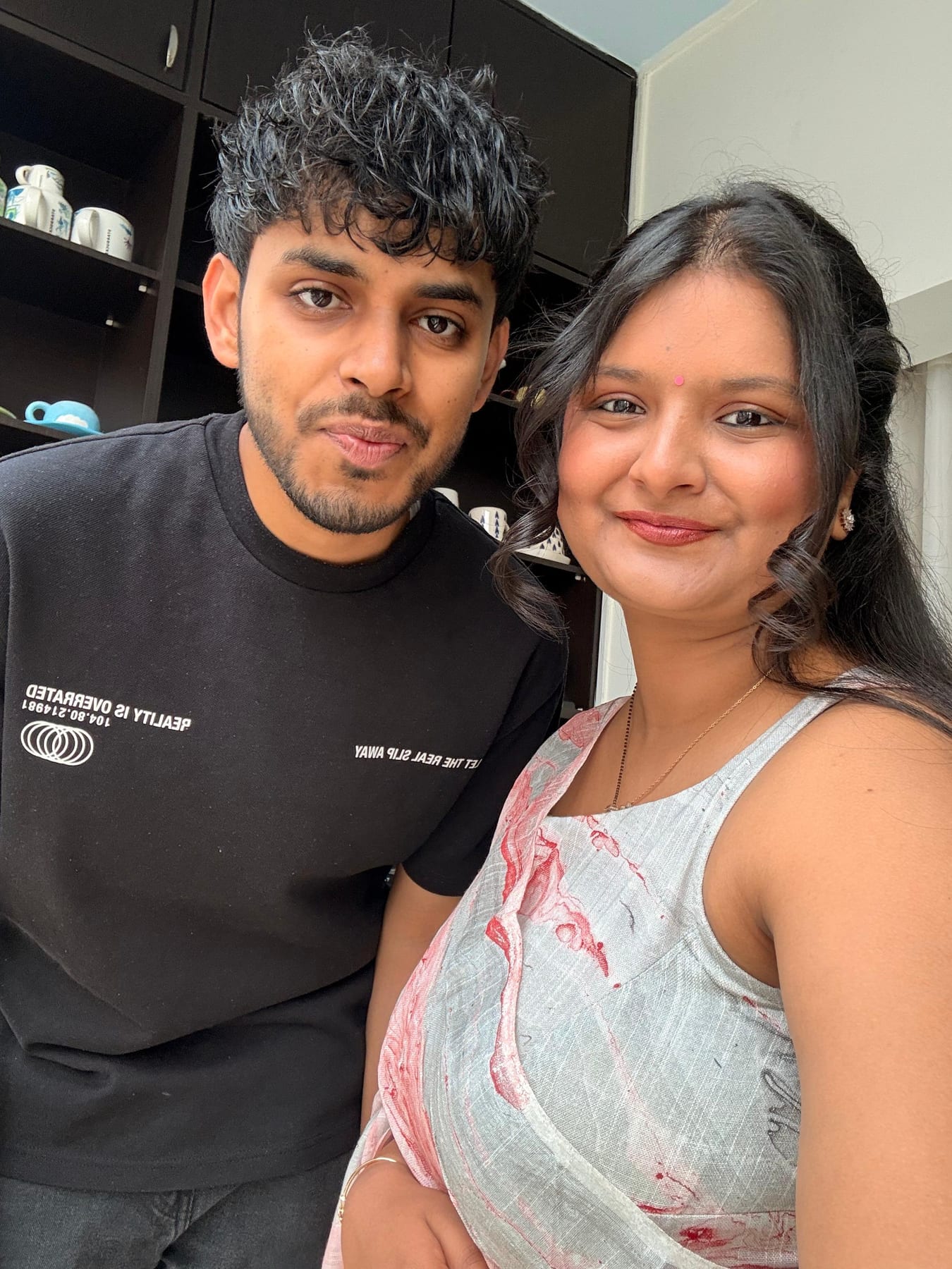 a saree, a black tee, a regular morning