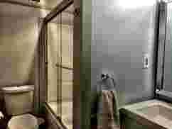 Hunger & Ransom Vacation Rental, Oscoda, MI · Downstairs Main Bath with Tub and Shower