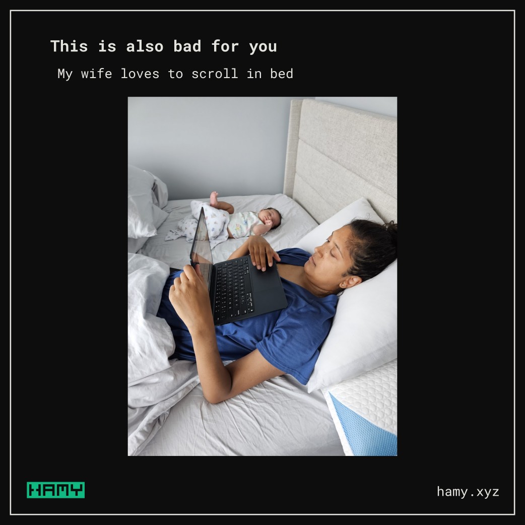 My wife using computer in bed