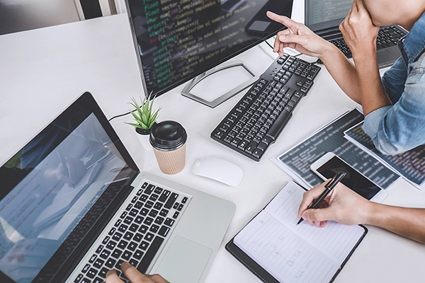 People coding together on computer