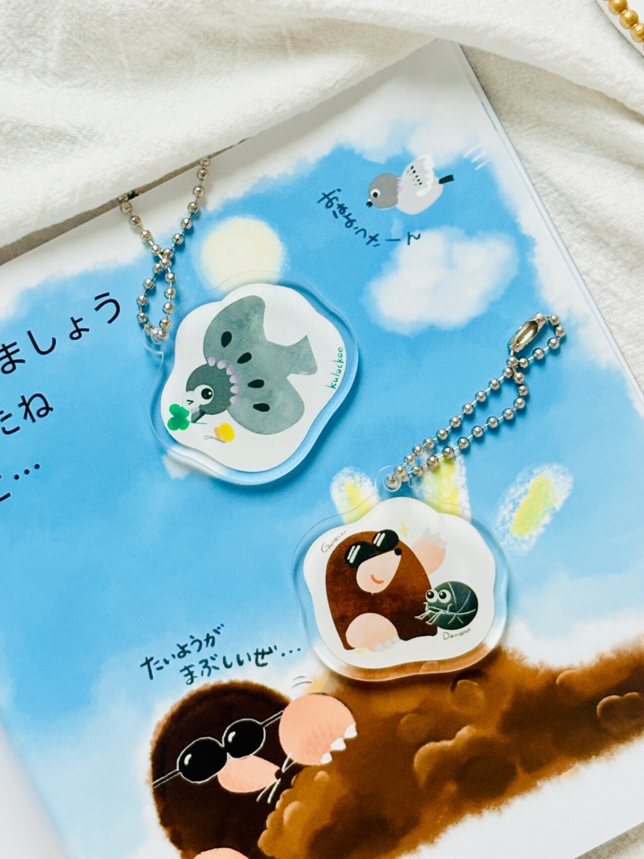 アクリルキーホルダー「くるっくー」｜ねこのたね 絵本キャラクター