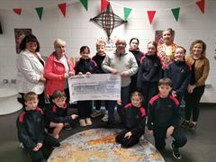Joan Bourke and Damian Slater on behalf of Mayo Roscommon Hospice accept a cheque for our recent Hospice Coffee Morning.