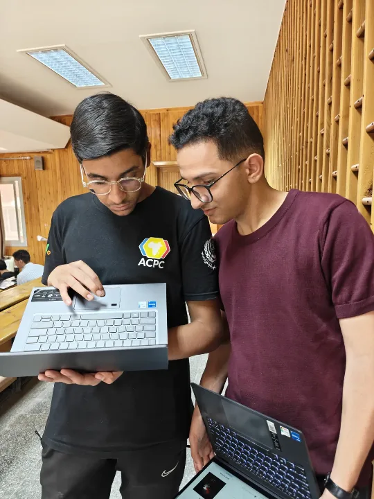 A mentor explaining a problem to a newcomer