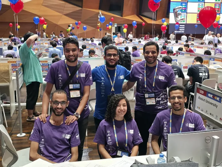 An Assiut team at their desk on the World Finals contest floor in Baku