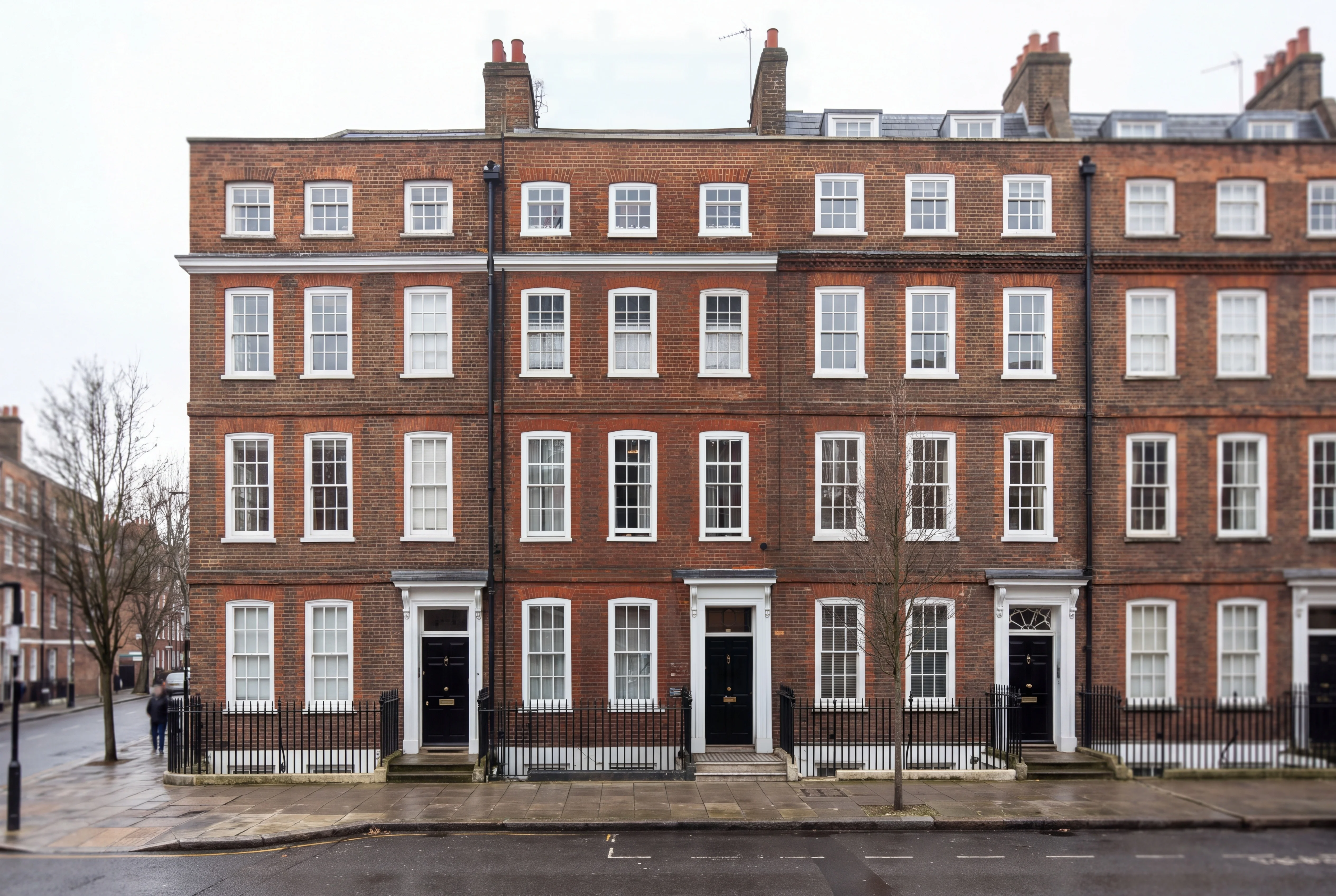 The same terrace with the scaffolding gone and the brick facade revealed