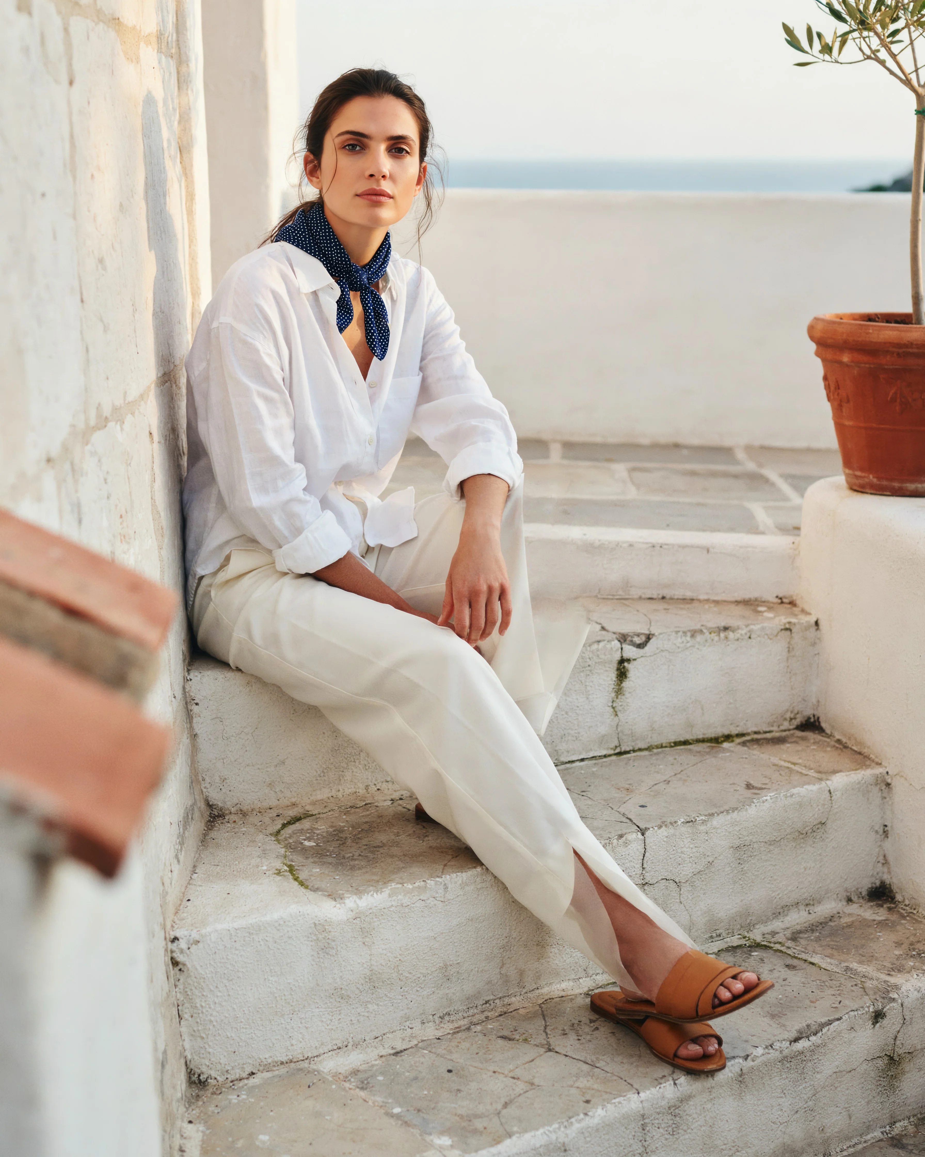 Change the green silk scarf to navy polka dots: the photo after the edit