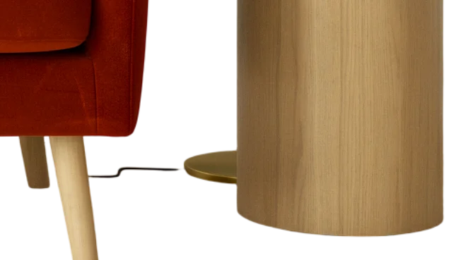 A close-up of Photoroom's cutout with the chair leg, the lamp cord, the round lamp base, and the side table.