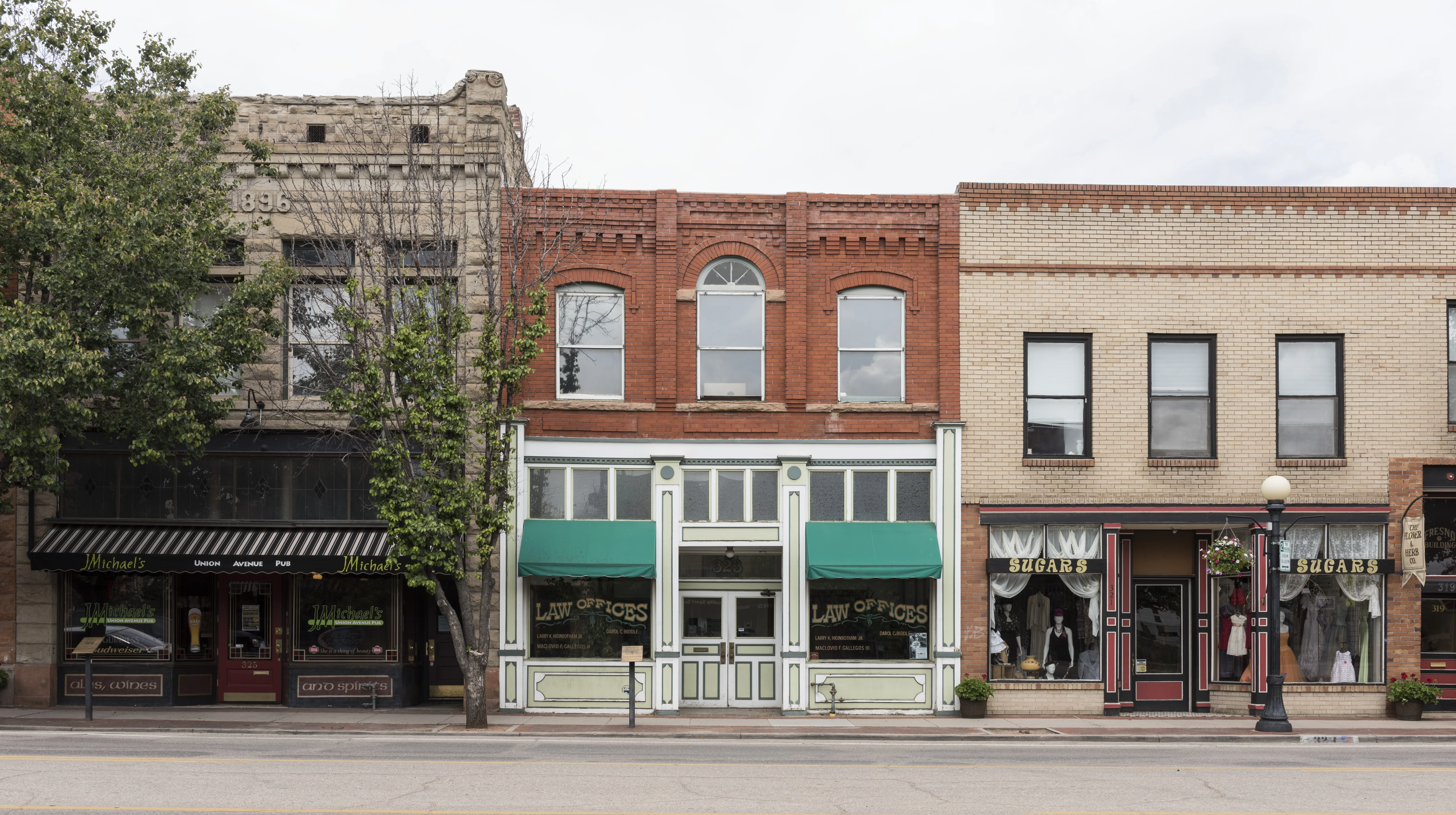 Storefronts on Union Avenue in Pueblo, Colorado, with two green awnings