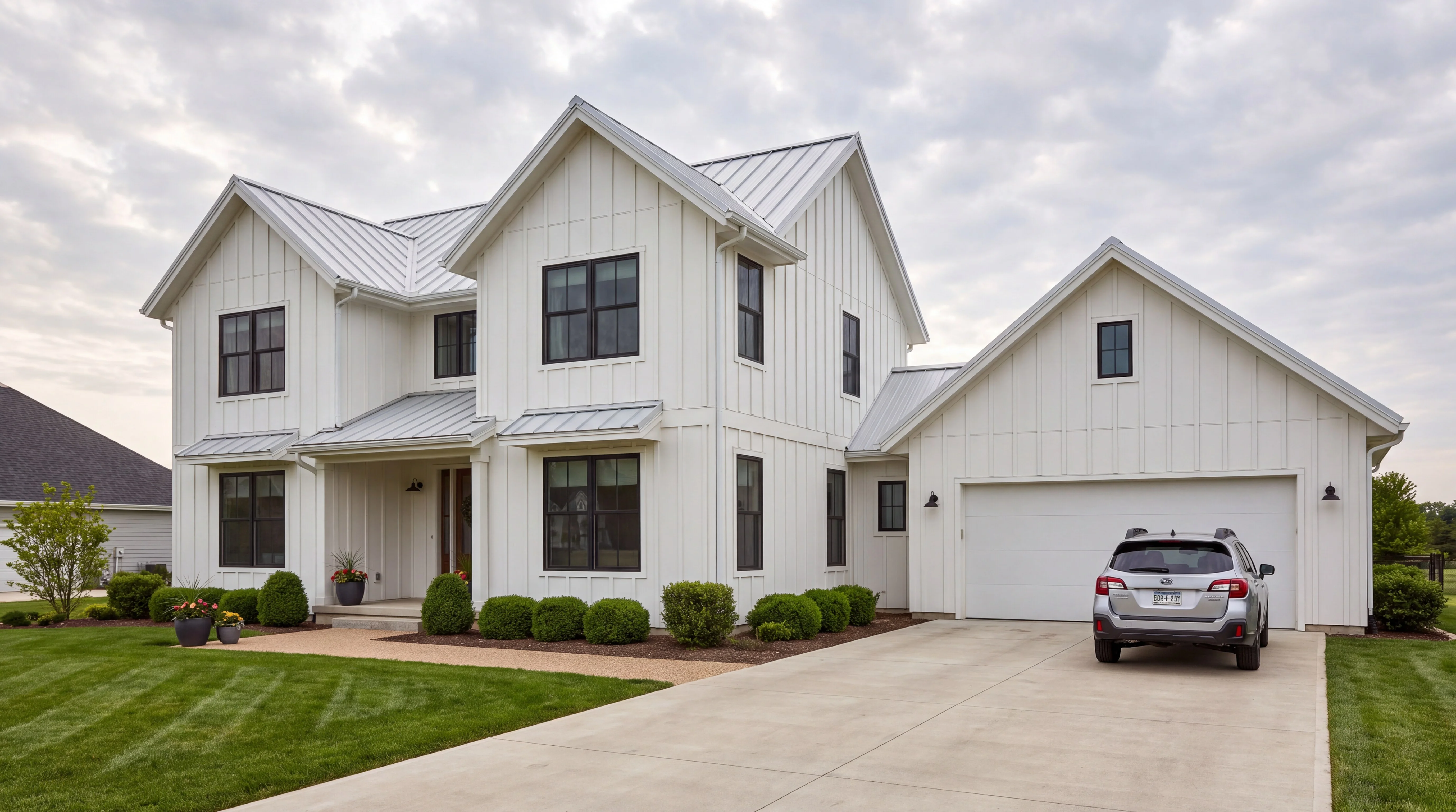 A listing photo of a white farmhouse with a car parked on the driveway