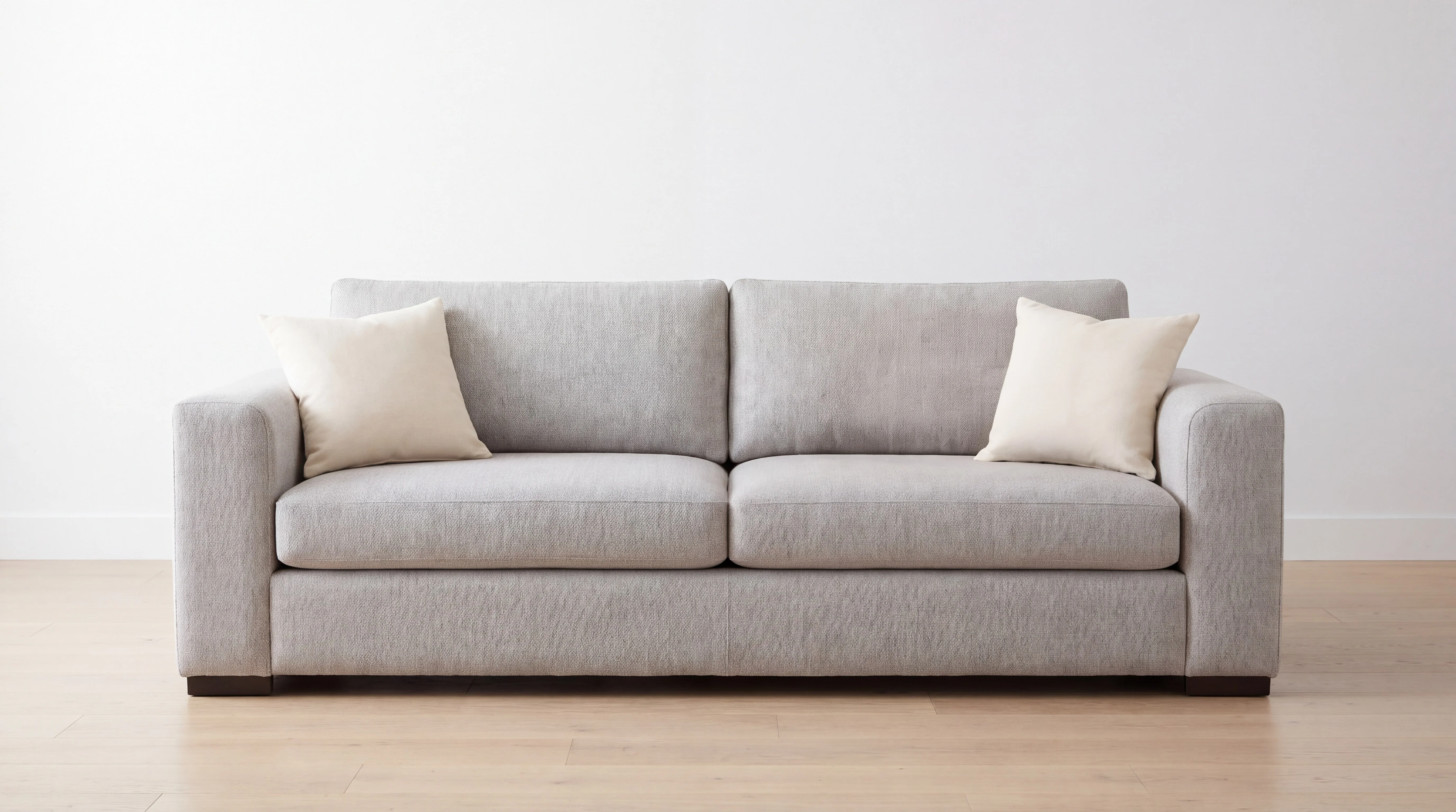 The same sofa with the mustard pillow removed