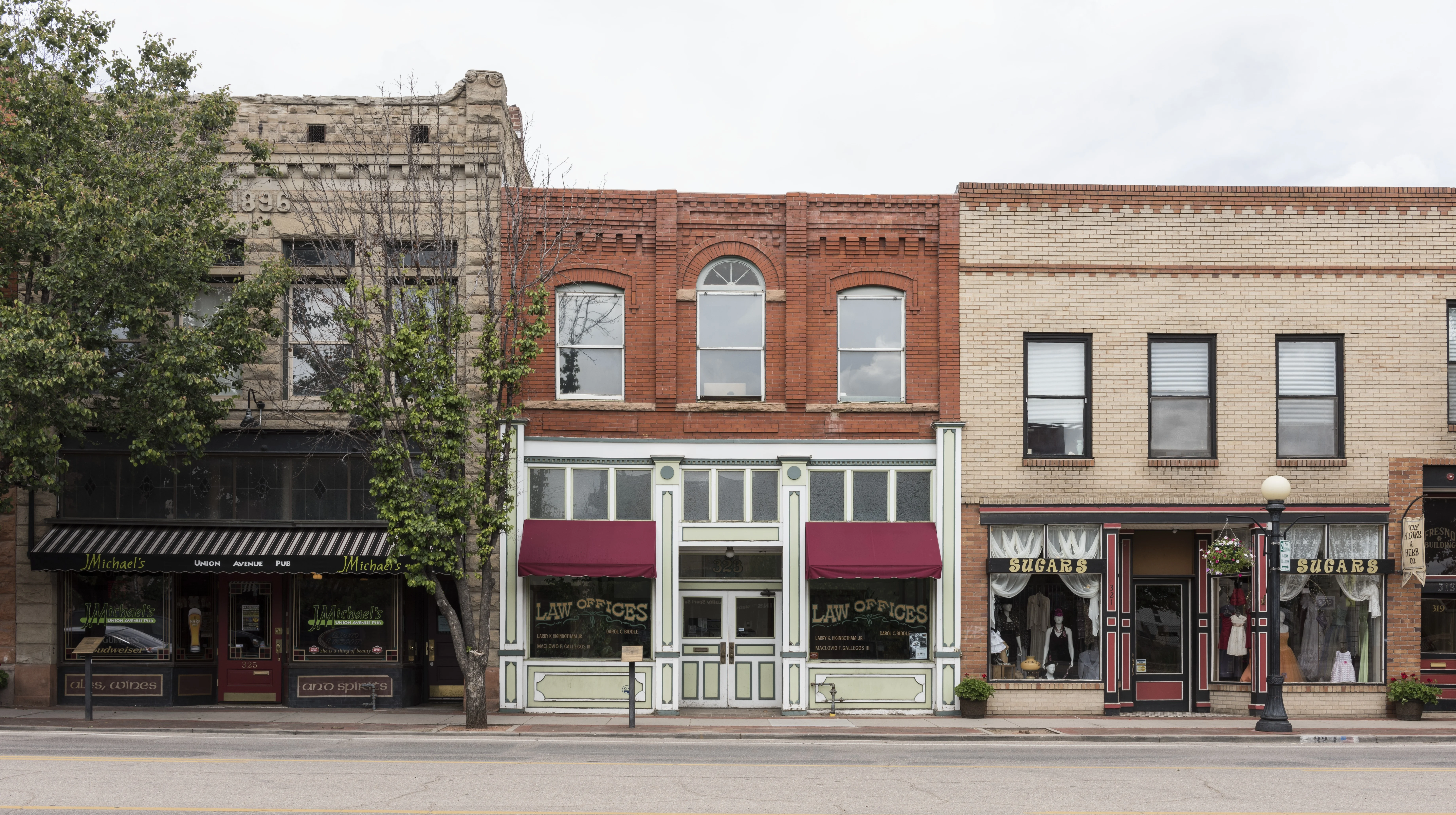 The same storefronts with the two awnings changed to burgundy