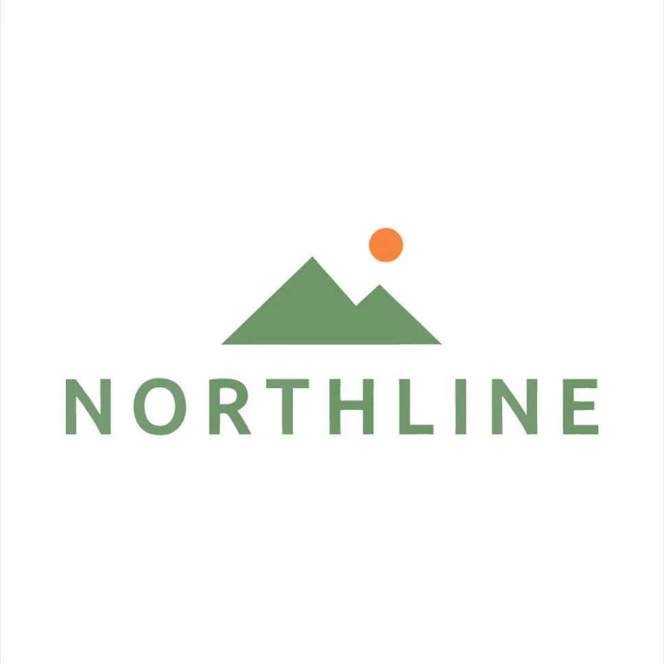 The NORTHLINE logo on a white background: two green mountain peaks with an orange sun above the right peak, over the word NORTHLINE in widely spaced green capitals.