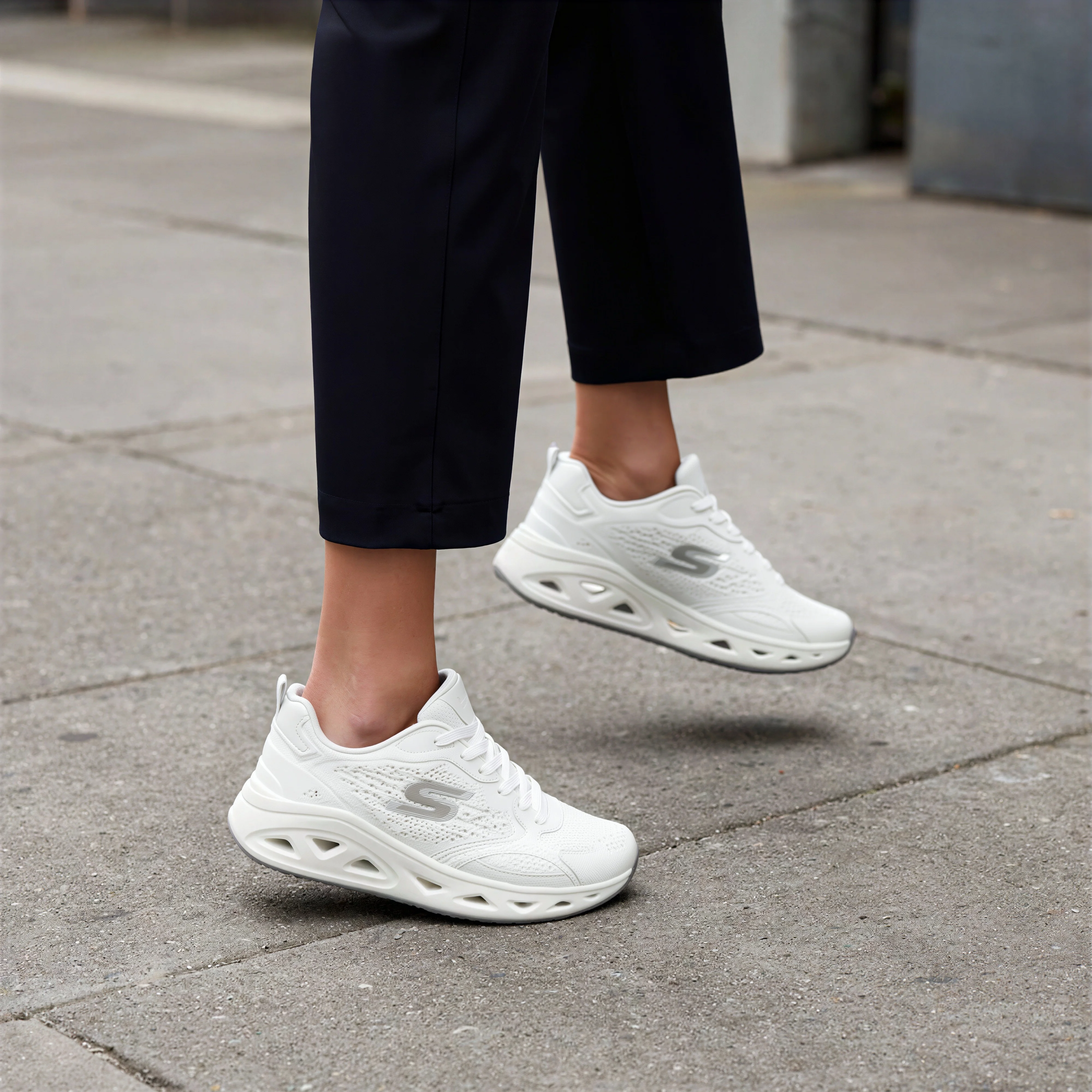 The same figure with the trainers swapped for the white pair from the reference