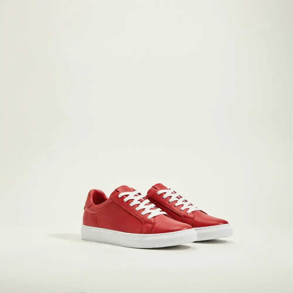 Red sneakers on a studio background