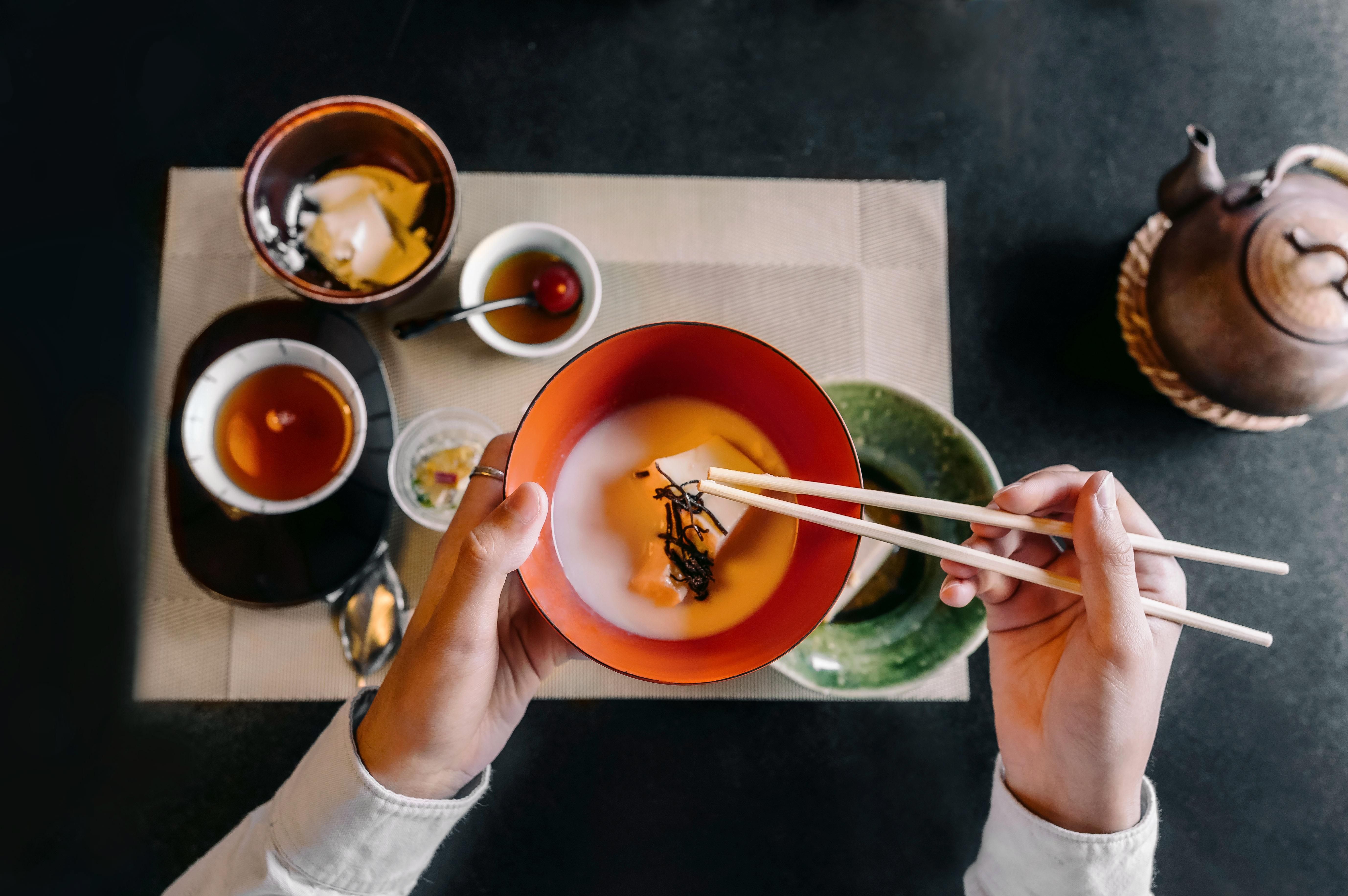 close-up-hand-holding-chopsticks.jpg