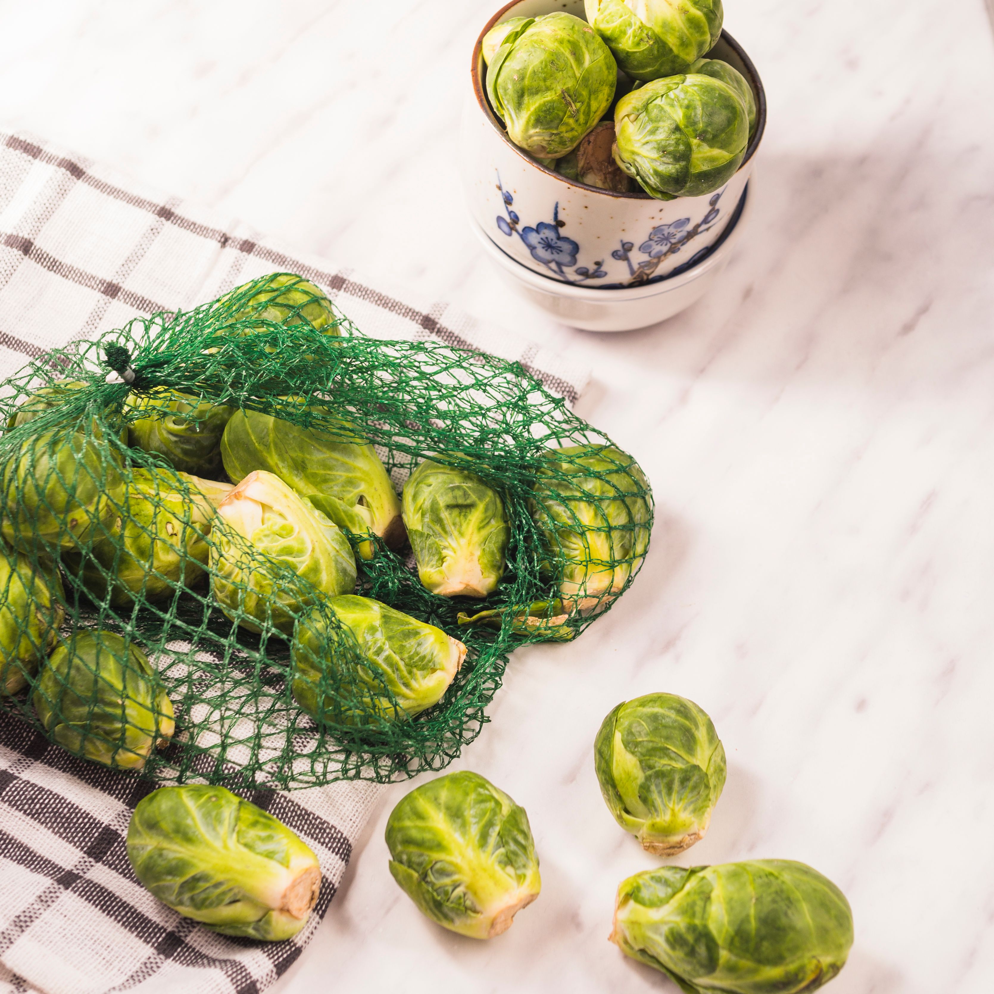 elevated-view-brussels-sprouts-net-chequered-pattern-textile.jpg