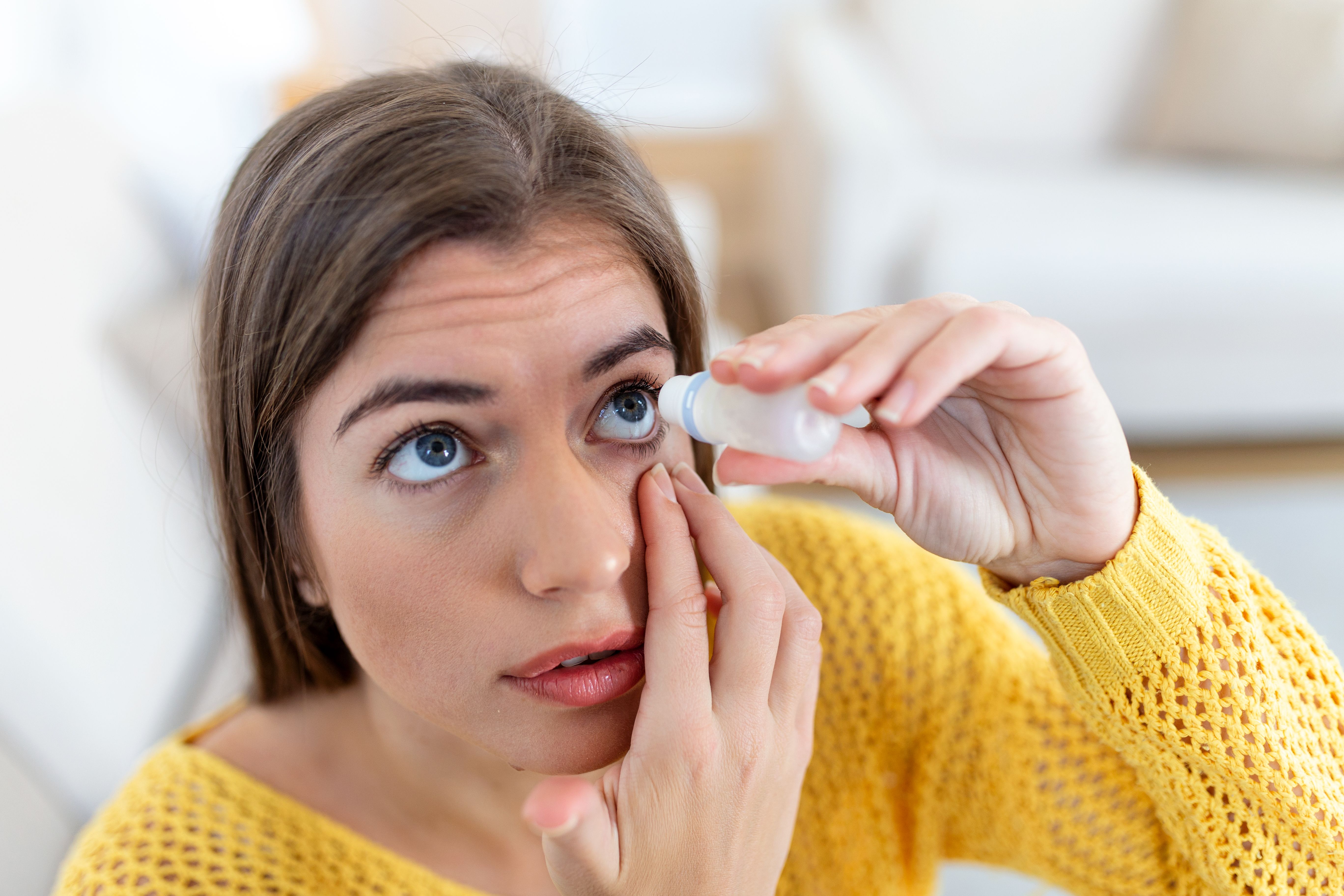 woman-using-eye-drop-woman-dropping-eye-lubricant-treat-dry-eye-allergy.jpg