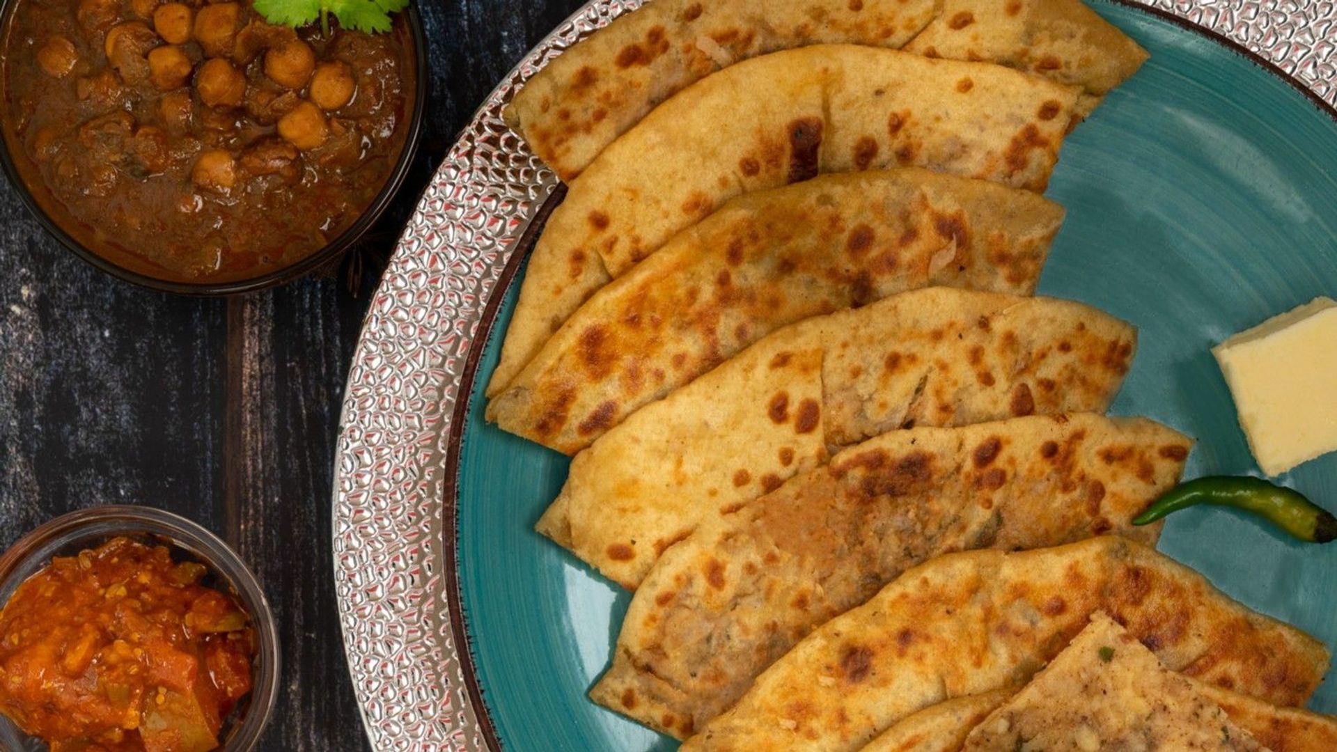 Amritsari Tava Kulcha with Chana, Raita & Dal Makhni