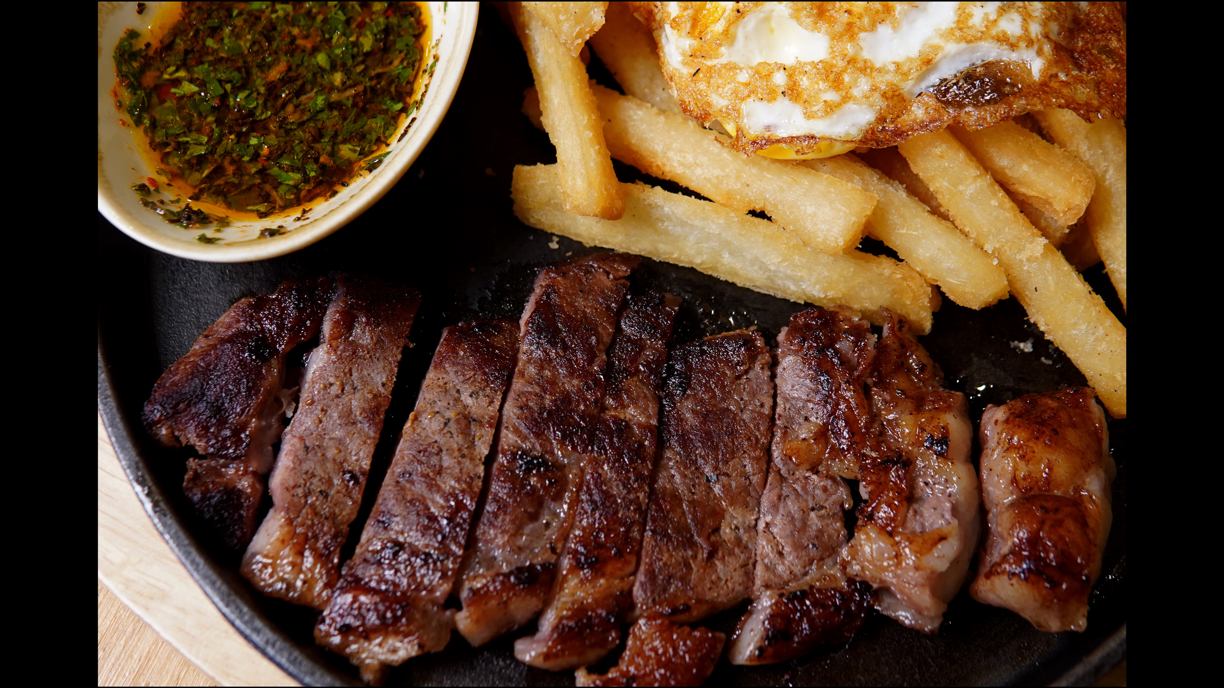 Steak And Egg (juicy steak + yuca fries + fried egg + chimi)