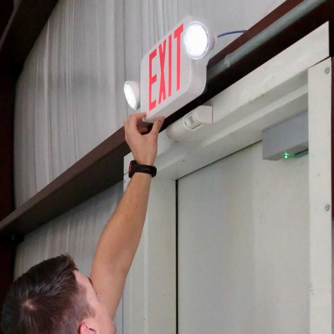 Emergency exit sign being tested during a routine fire protection inspection.