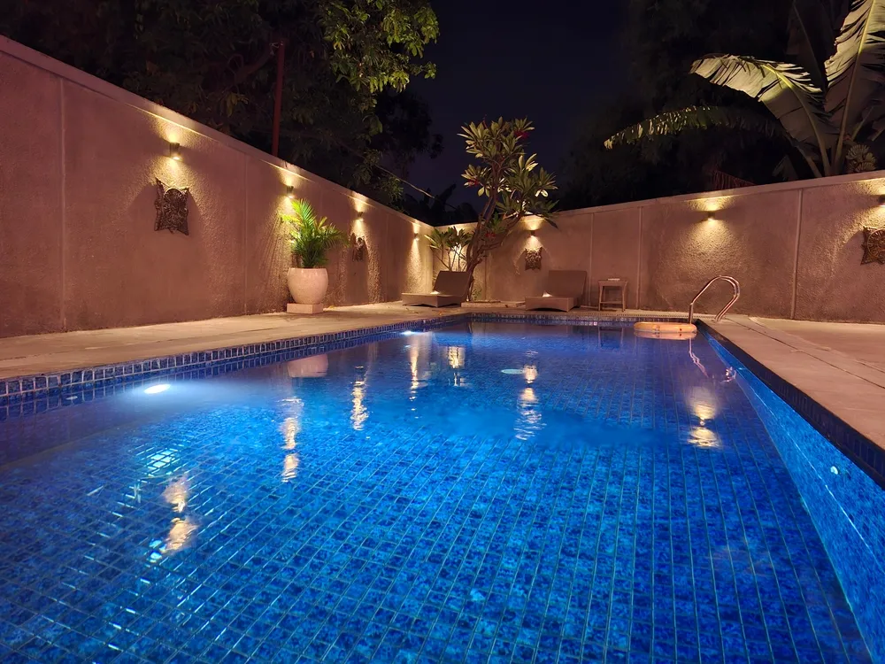 Luxury backyard pool designed during home remodeling in Fresno CA after an initial consultation to prevent water damage and complement kitchen remodel upgrades.