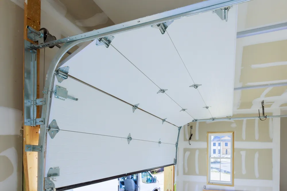 Garage Door Specialist of NWA team installing a high-quality garage door in Rogers, AR.